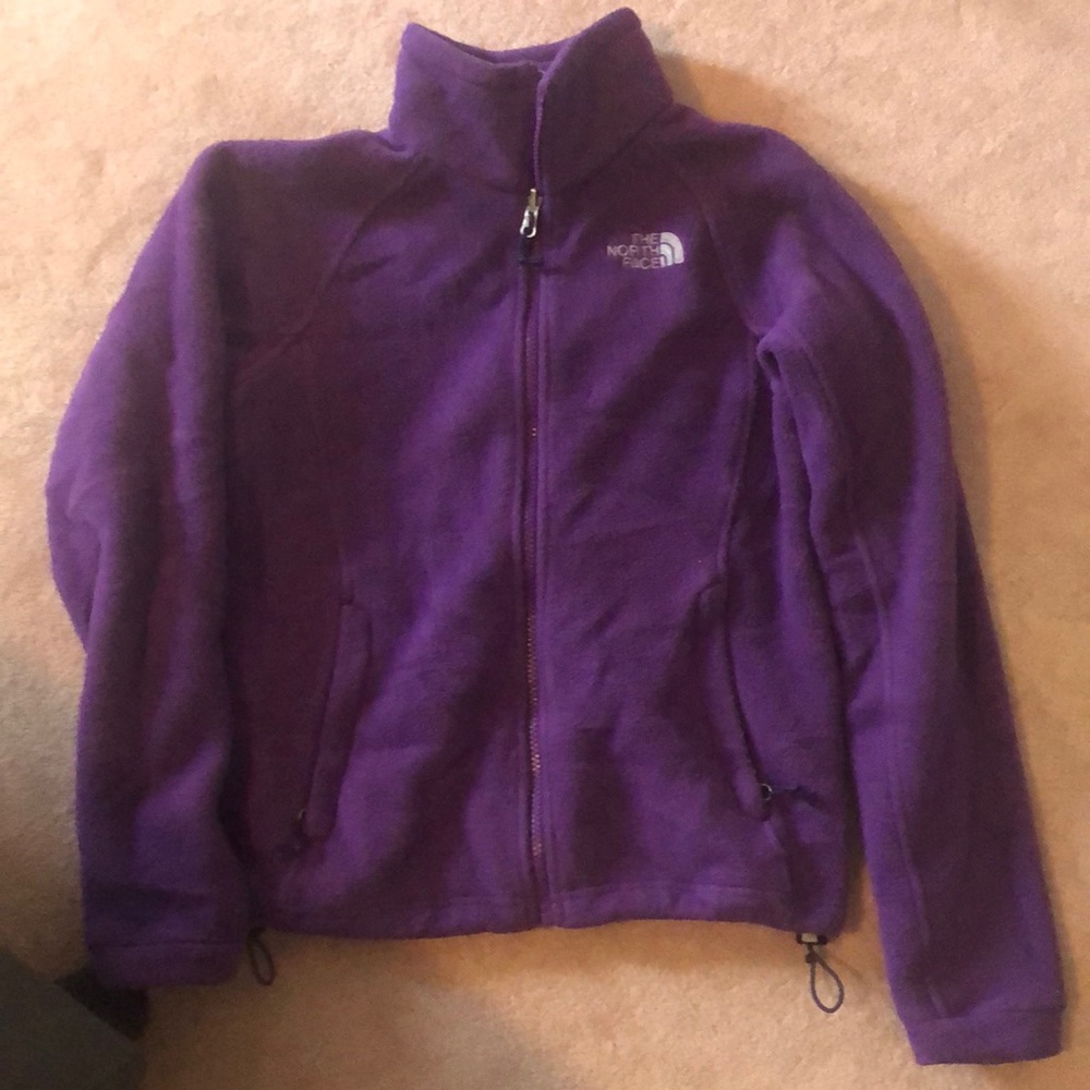 A purple north face fleece jacket